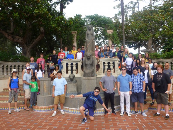 Students pose in front of a sculpture of the Egyptian goddess Sekhmet (3,000 BP) at Hearst Castle.