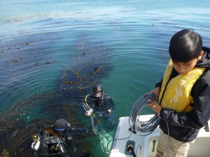 Luis, 8th grade, helps guide the ROV into the water.
