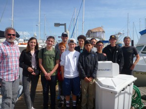 Students from the robotics class gets ready to launch the ROV, along with Headmaster Gordon Sichi and robotics teacher Bryan Anderson.