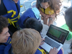 Students control the OpenROV from a laptop on the Channelkeeper boat.